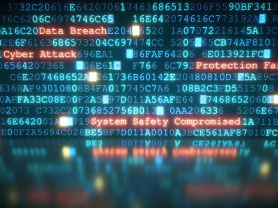 A close-up on an abstract design of a display, which is warning about a cyber attack. Multiple rows of hexadecimal code are interrupted by red glowing warning text. Part of the display is reflected on a shiny surface. The image can represent a variety of threats in the digital world: data theft, data leak, security breach, intrusion, etc...